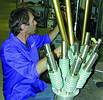 Machinist working on EW antennas in the workshop